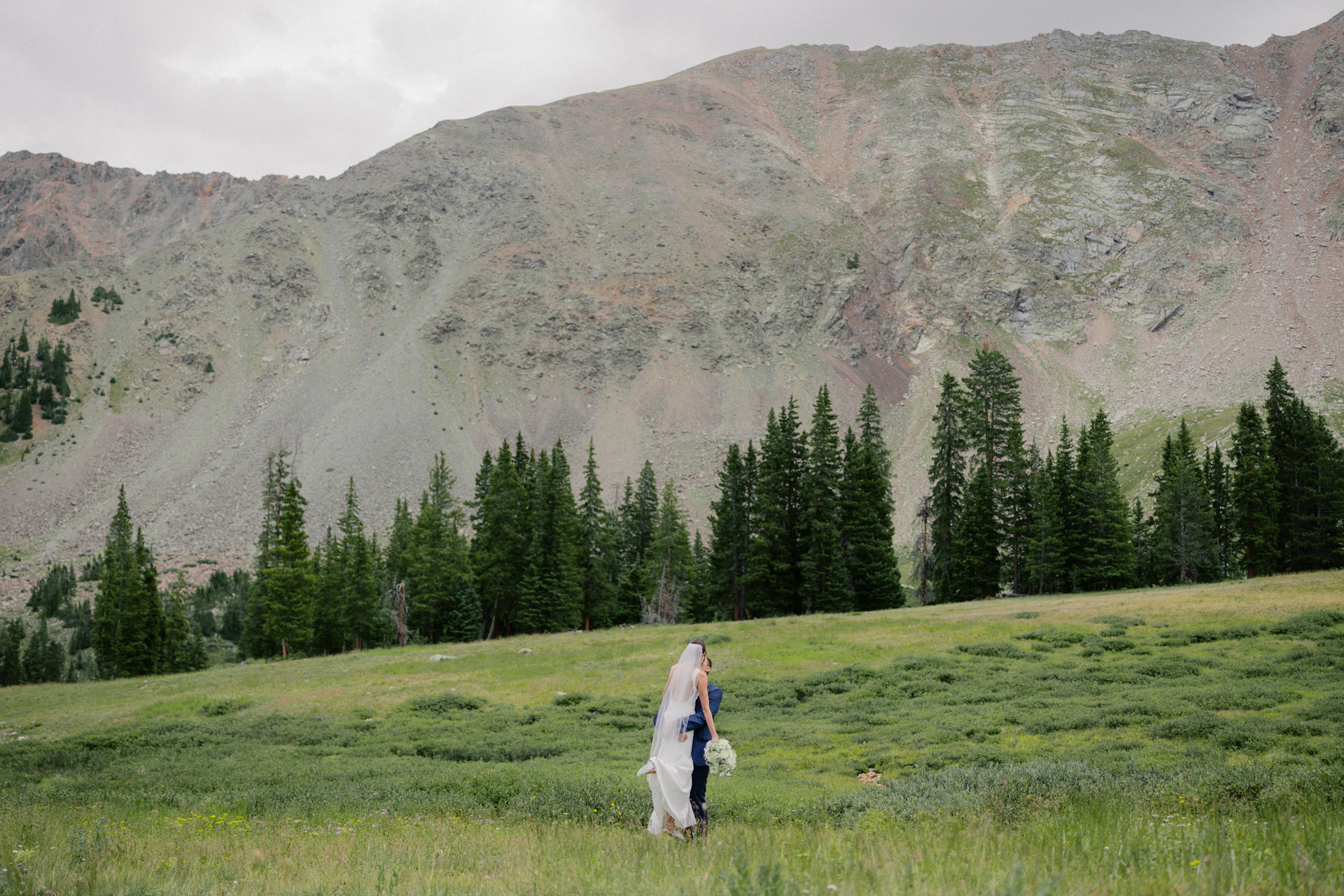 A-Basin wedding couple's portrait in a field