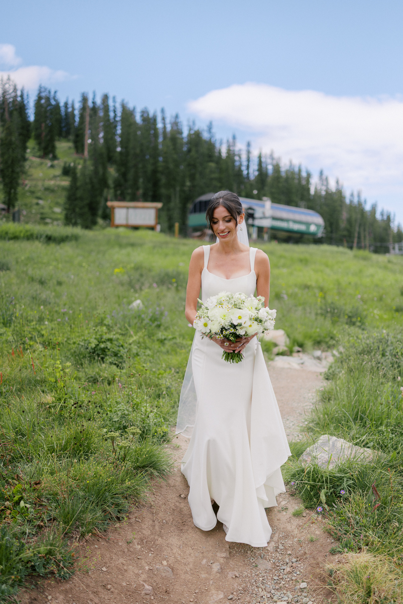 Arapahoe Basin bride walking through a field